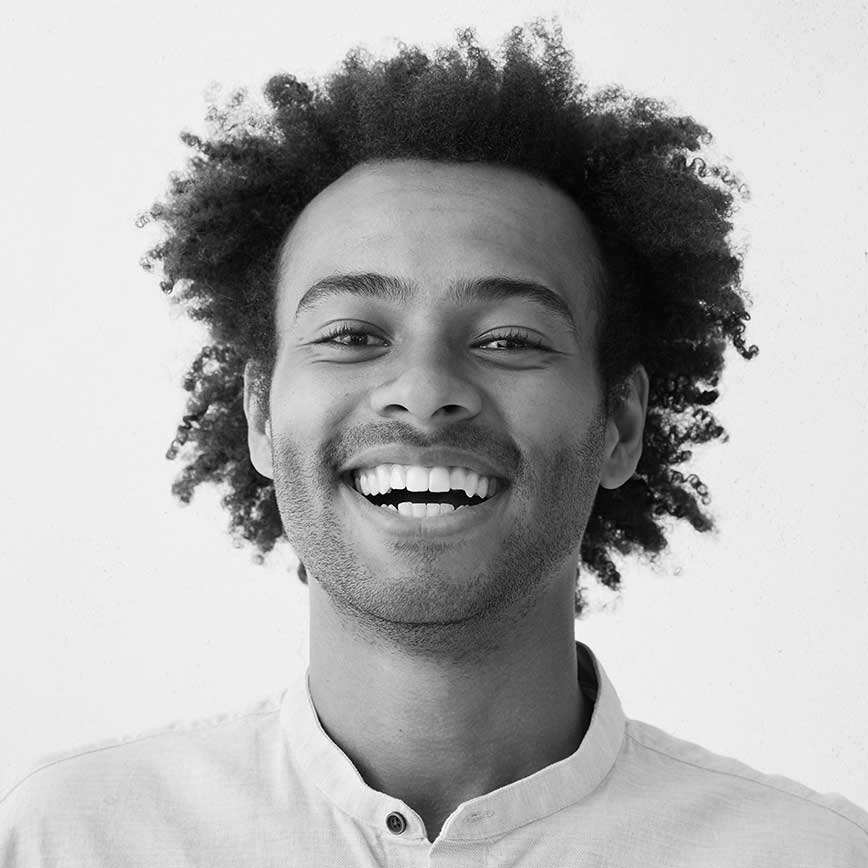 Young Black man smiling